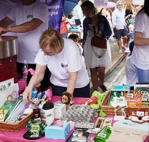 Volunteers helping at an event stall