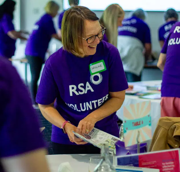 Volunteers helping at an event stall