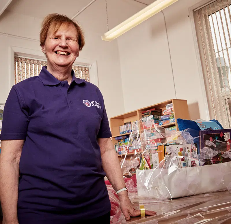Volunteer making hampers