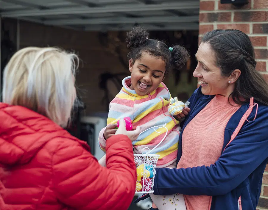 A child being given a small gift