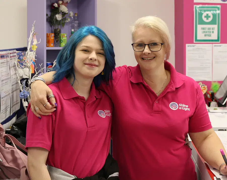 Two members of the Shine A Light Team